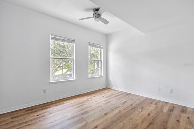 unfurnished room featuring ceiling fan and light wood-type flooring