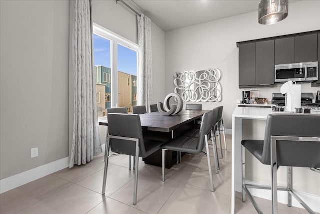 dining room featuring light tile patterned flooring