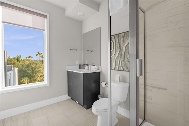 bathroom featuring vanity, toilet, and a shower