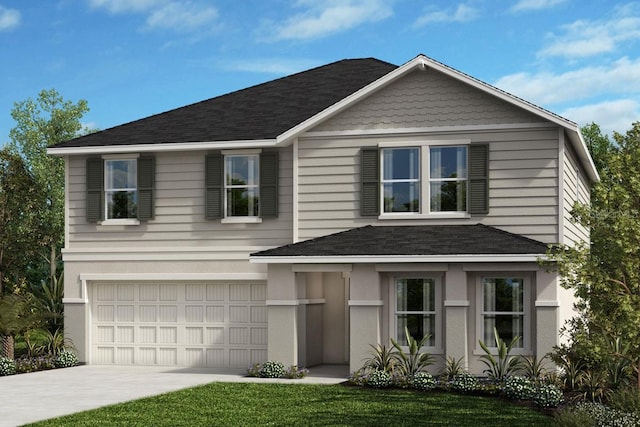 view of front property with a garage and a front yard