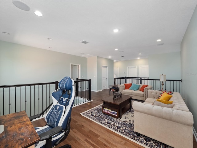 living room with dark hardwood / wood-style flooring