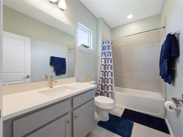 full bathroom featuring vanity, toilet, tile patterned floors, and shower / bath combination with curtain