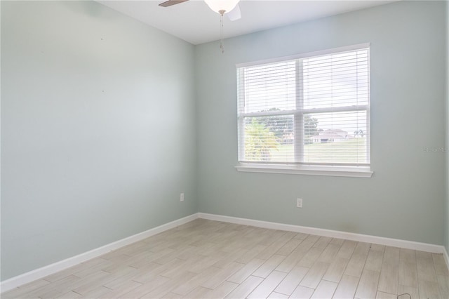 empty room with light hardwood / wood-style floors and ceiling fan