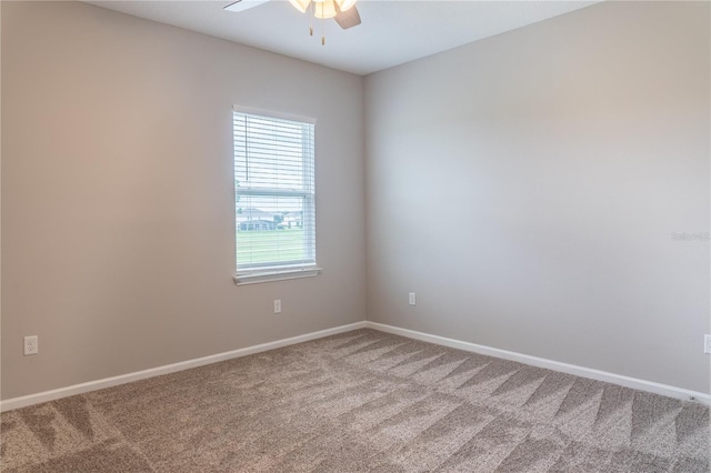 carpeted empty room with ceiling fan