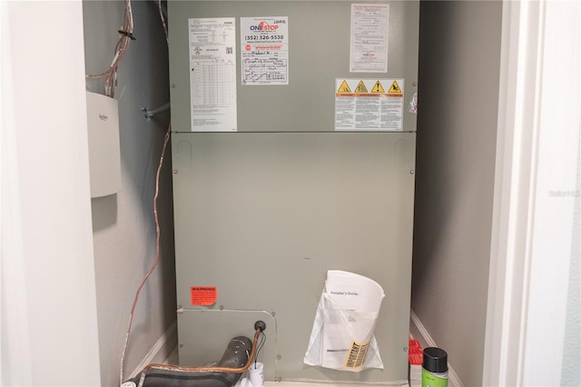 utility room with heating unit