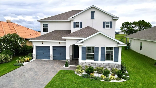 view of front of home with a garage and a front yard