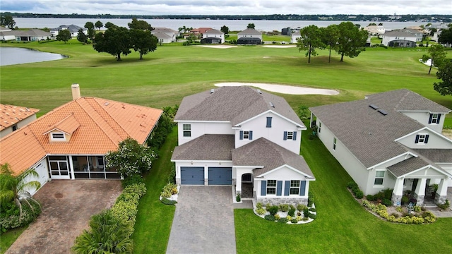 bird's eye view with a water view