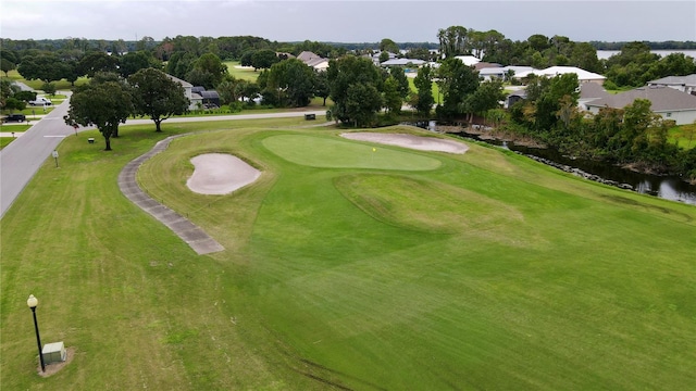 surrounding community with a water view