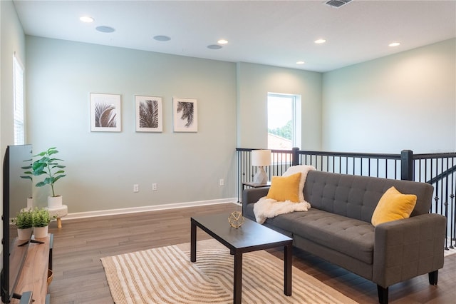 living room with light hardwood / wood-style floors