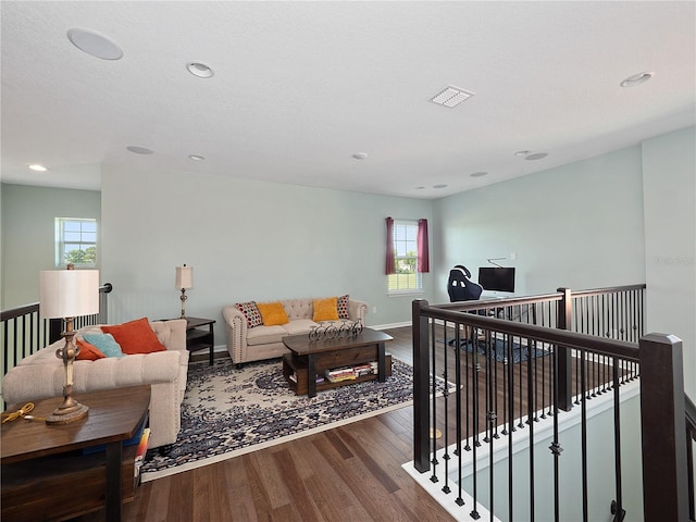 living room featuring hardwood / wood-style floors and a healthy amount of sunlight