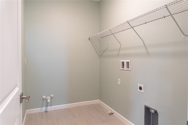 clothes washing area with washer hookup and hookup for a gas dryer