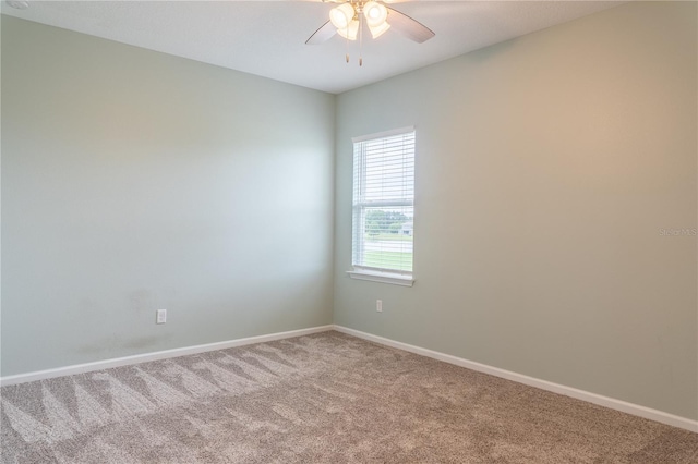 carpeted empty room with ceiling fan