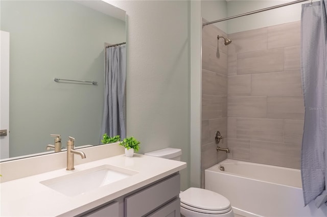 full bathroom with shower / tub combo, vanity, and toilet