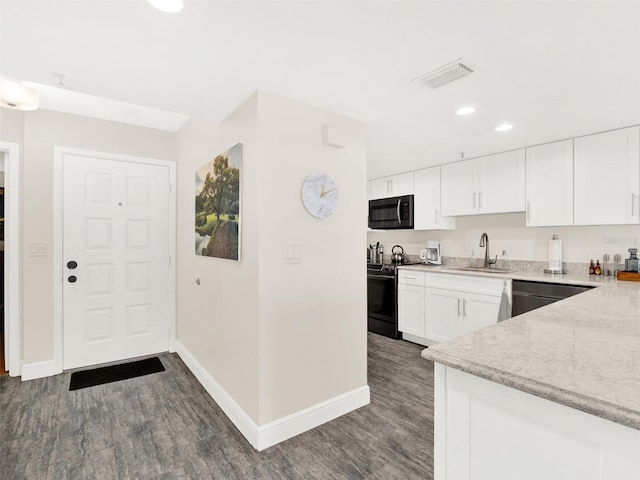 kitchen featuring dishwashing machine, sink, white cabinetry, electric range, and dark hardwood / wood-style floors