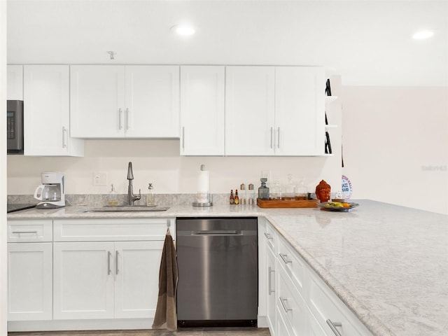 kitchen with sink, white cabinets, dishwasher, and light stone counters