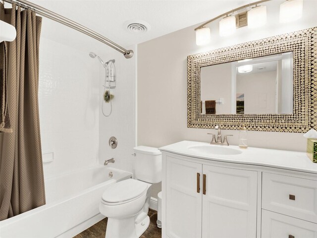 full bathroom featuring toilet, vanity, and shower / tub combo