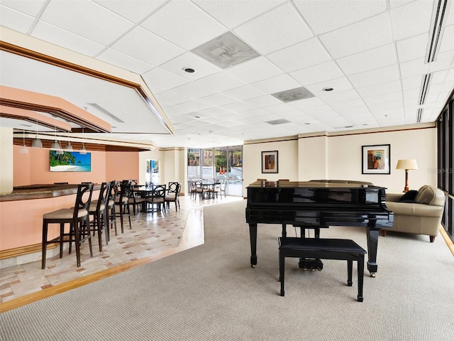 miscellaneous room with light colored carpet and a drop ceiling