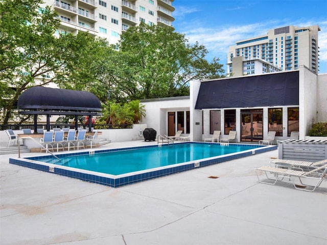 view of swimming pool with a patio