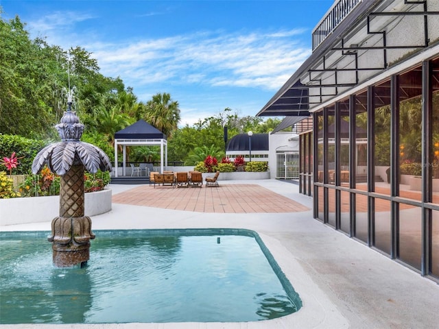 view of pool featuring a gazebo and a patio