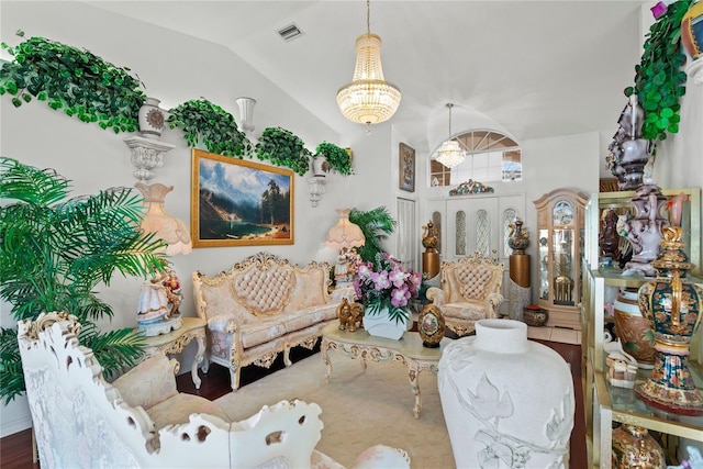 living area featuring a notable chandelier and vaulted ceiling