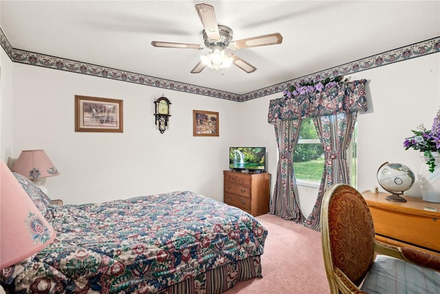 bedroom featuring light colored carpet and ceiling fan