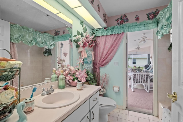 bathroom with vanity, toilet, and tile patterned flooring