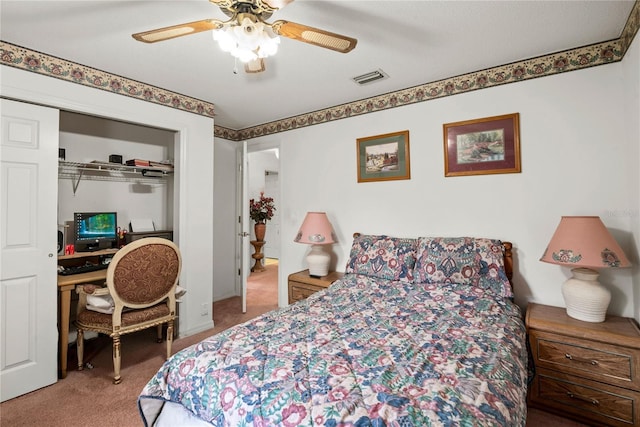 bedroom featuring light colored carpet, a closet, and ceiling fan