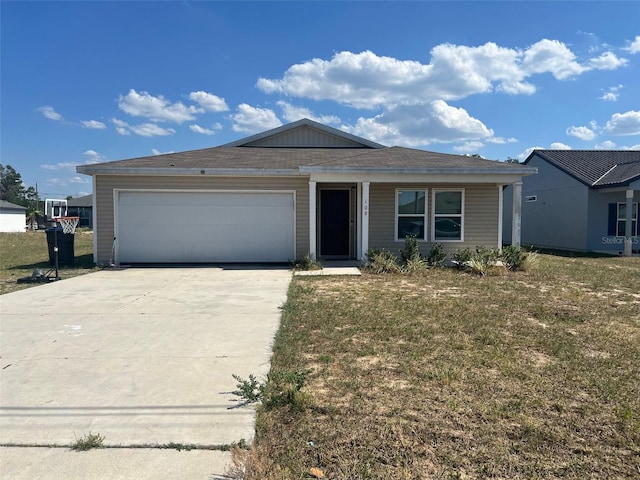 single story home featuring a garage and a front lawn