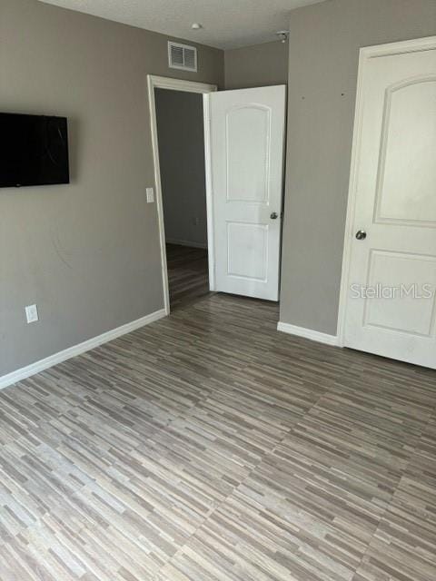 unfurnished bedroom with light hardwood / wood-style flooring