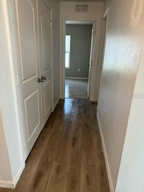 hallway featuring wood-type flooring