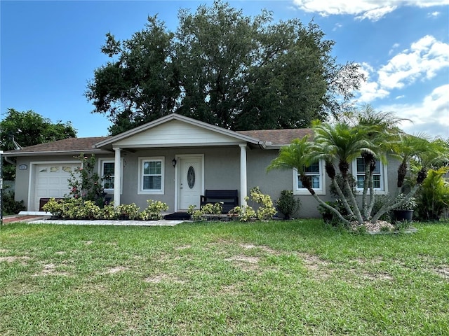 ranch-style home featuring a garage and a front lawn