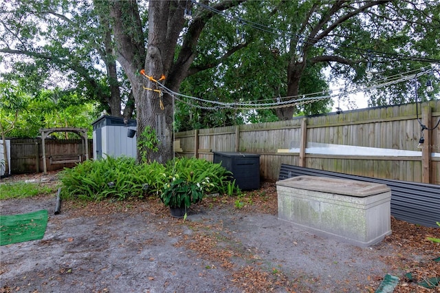 view of patio / terrace with a storage shed