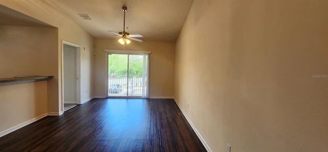 unfurnished room featuring ceiling fan, dark hardwood / wood-style flooring, and lofted ceiling