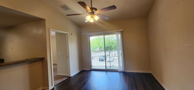 spare room featuring ceiling fan, dark hardwood / wood-style floors, and lofted ceiling