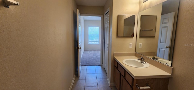 bathroom featuring tile patterned flooring and vanity