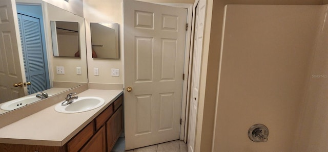 bathroom with tile patterned floors and vanity