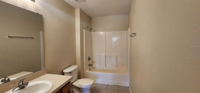 full bathroom featuring vanity, a textured ceiling, washtub / shower combination, tile patterned flooring, and toilet