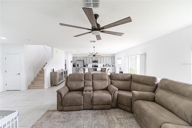 living room with ceiling fan and light tile floors