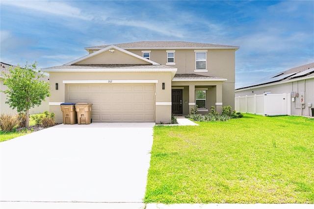 front of property featuring a garage, a front yard, and solar panels