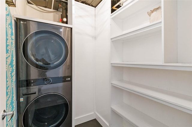 laundry room with stacked washer and clothes dryer