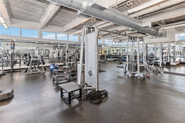 workout area with a high ceiling