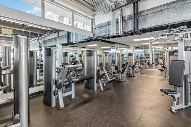 exercise room featuring a high ceiling