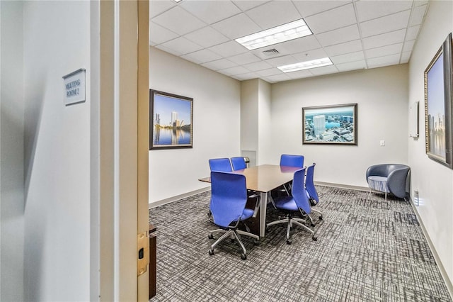 home office featuring carpet floors and a drop ceiling