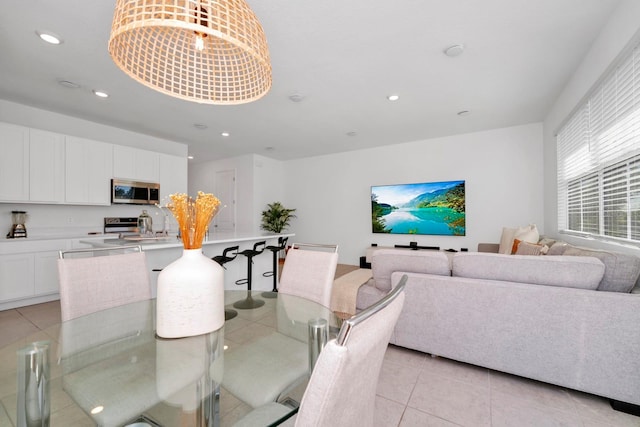 dining area with light tile floors