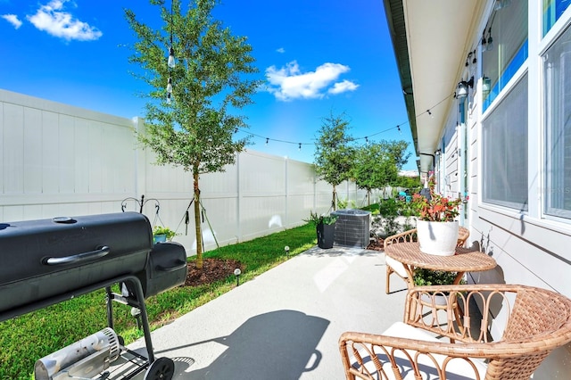 view of patio / terrace featuring a grill and central AC