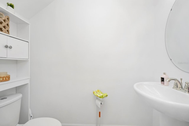 bathroom featuring sink and toilet