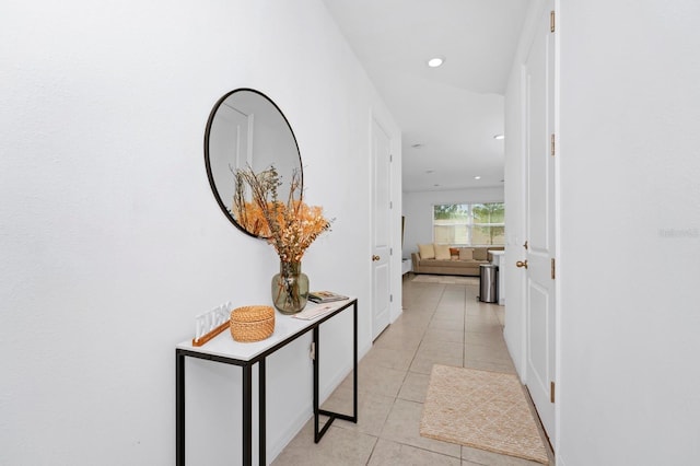 hall featuring light tile floors