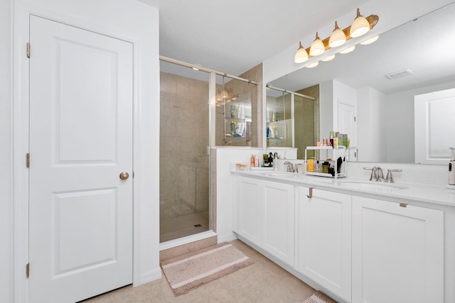 bathroom with walk in shower, tile flooring, and double vanity