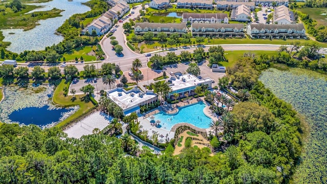 birds eye view of property with a water view