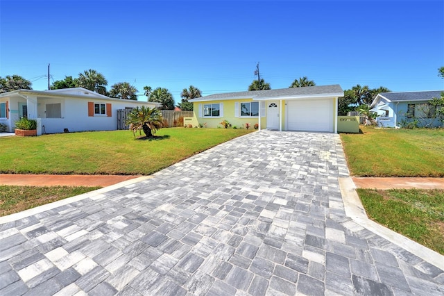 ranch-style house featuring a garage and a front yard